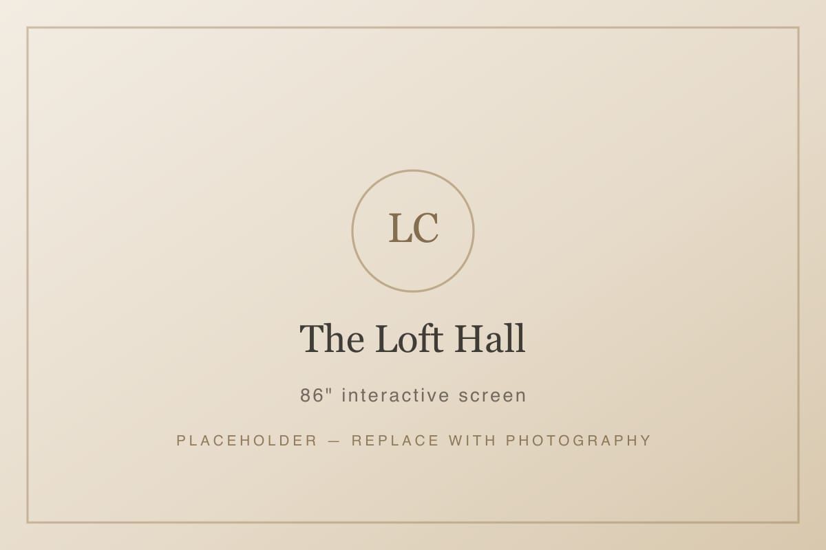 The Loft Hall arranged in a boardroom layout, with the interactive touchscreen at the head of the table.